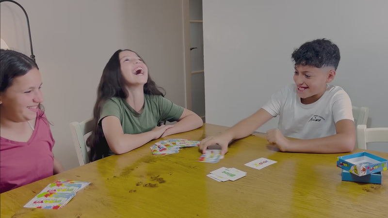 Kids playing DIDAYO card game.
DIDAYO – Say It Right!
DIDAYO is a Fast-Paced Fun Card Game for kids ages 8-12 and adults. Players must quickly say the correct word or color, not always matching what's written on the cards.
The game's core mechanic revolves around the interplay between the color and text on the cards, with the Mode Card determining how players should respond. The addition of Action Cards adds variety and unpredictability to the gameplay.
